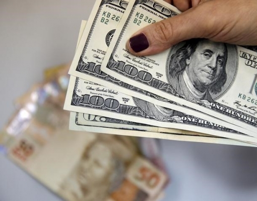 Dólar cai ante real com apetite por risco no exterior